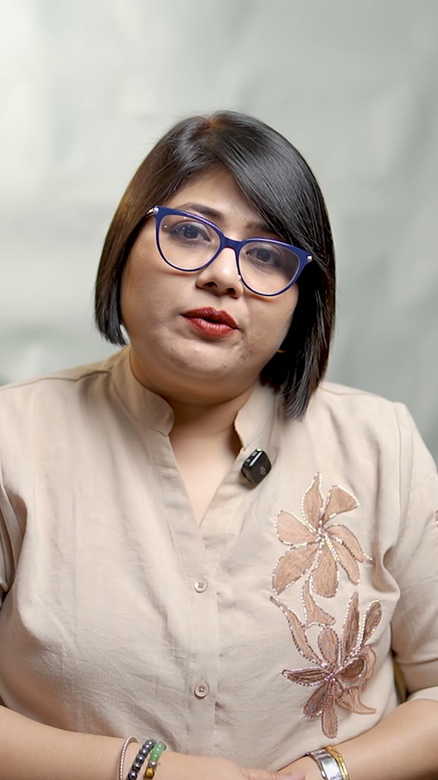Dr. Sayoni Bhanja speaking to camera in a cream embroidered top